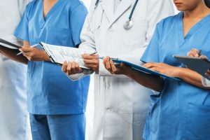 Confident medical staff team with doctor nurse and healthcare specialist professions people in hospital or clinic office. Medical and healthcare community in panoramic banner. Neoteric