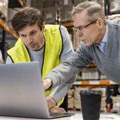 men-warehouse-working-laptop
